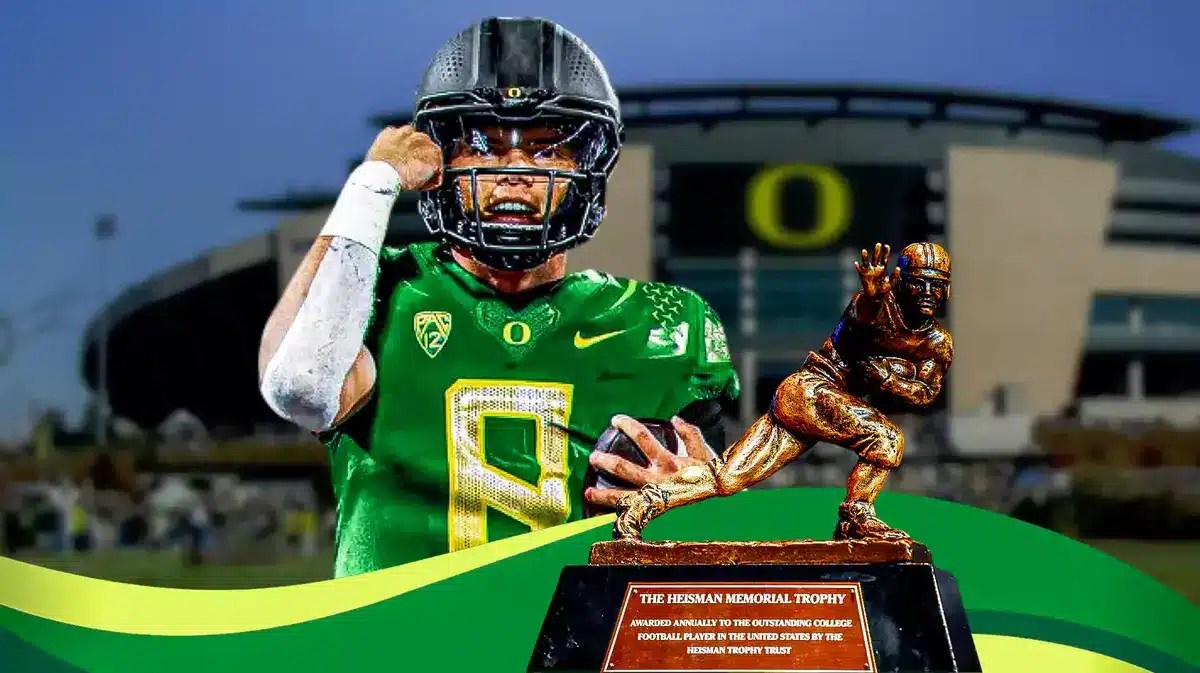 Dillon Gabriel in Oregon Ducks uniform with Heisman Trophy