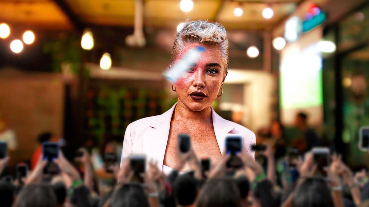 Florence Pugh in front of a crowd with something hitting her face.
