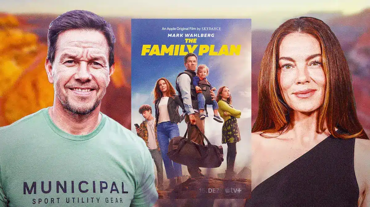 Mark Wahlberg and Michelle Monaghan between The Family Plan poster.