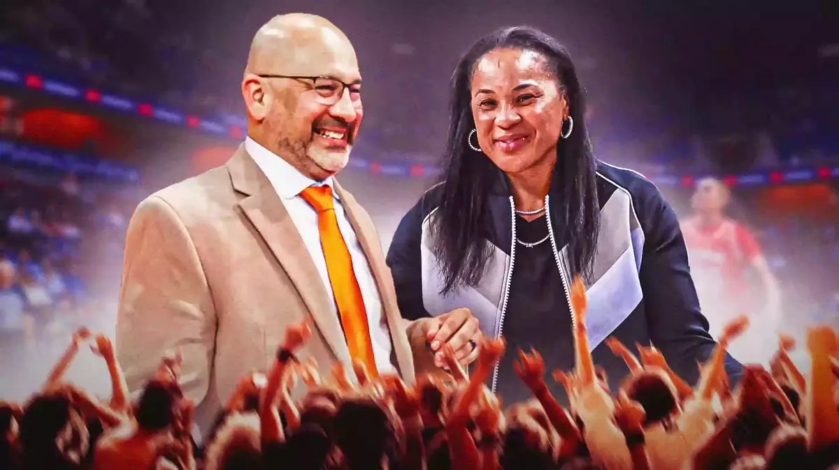 South Carolina women’s basketball coach Dawn Staley, and Bowling Green State women’s basketball coach Fred Chmiel, both looking happy, on a basketball court