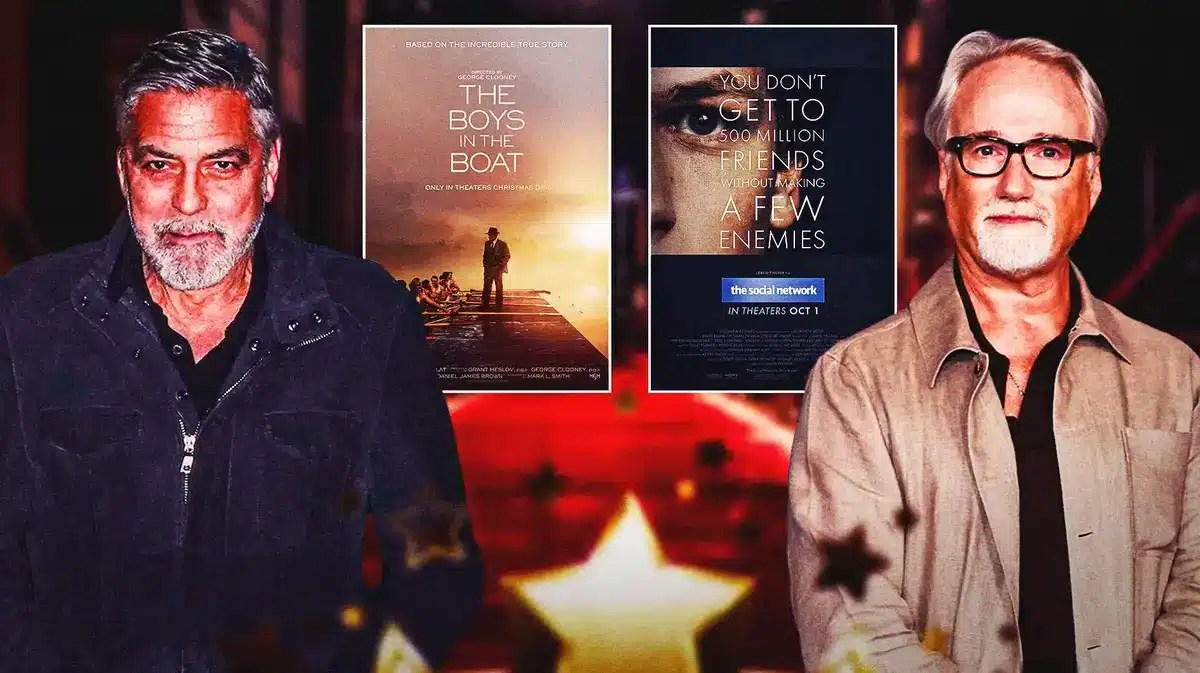 George Clooney and David Fincher in front of posters of The Boys in the Boat and The Social Network.
