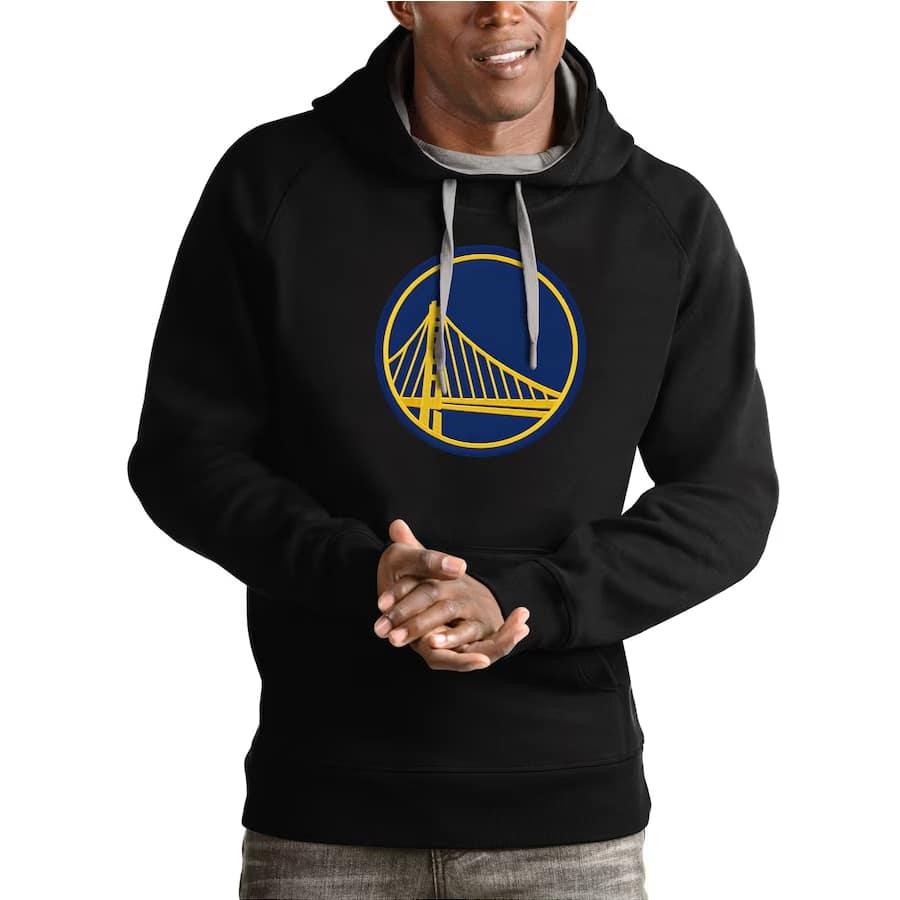 Golden State Warriors Antigua Team Logo Victory Pullover Hoodie - Black colored on a model on a white background.