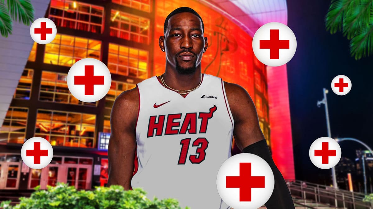 Miami Heat's Bam Adebayo next to injury signs in front of the Kaseya Center.