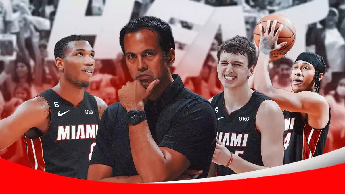 Miami Heat's Erik Spoelstra, Nikola Jovic, Jamal Cain, and R.J. Hampton in front of the Kaseya Center.