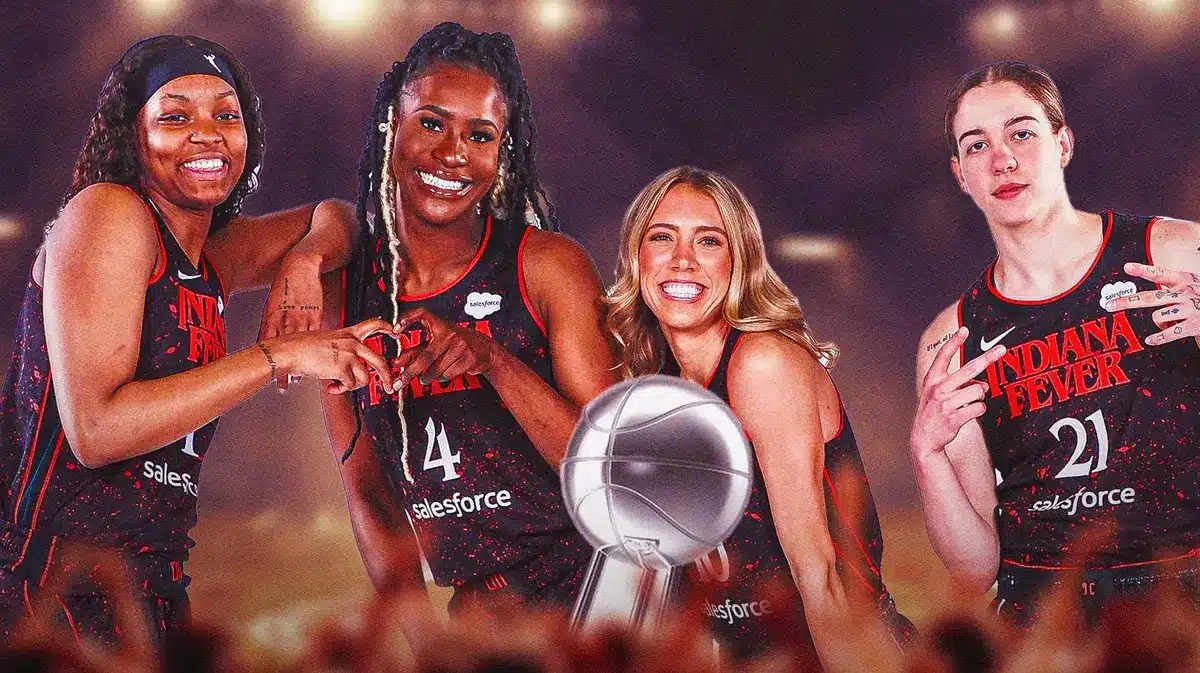 Players from the WNBA team the Indiana Fever, looking excited, with the WNBA Finals trophy