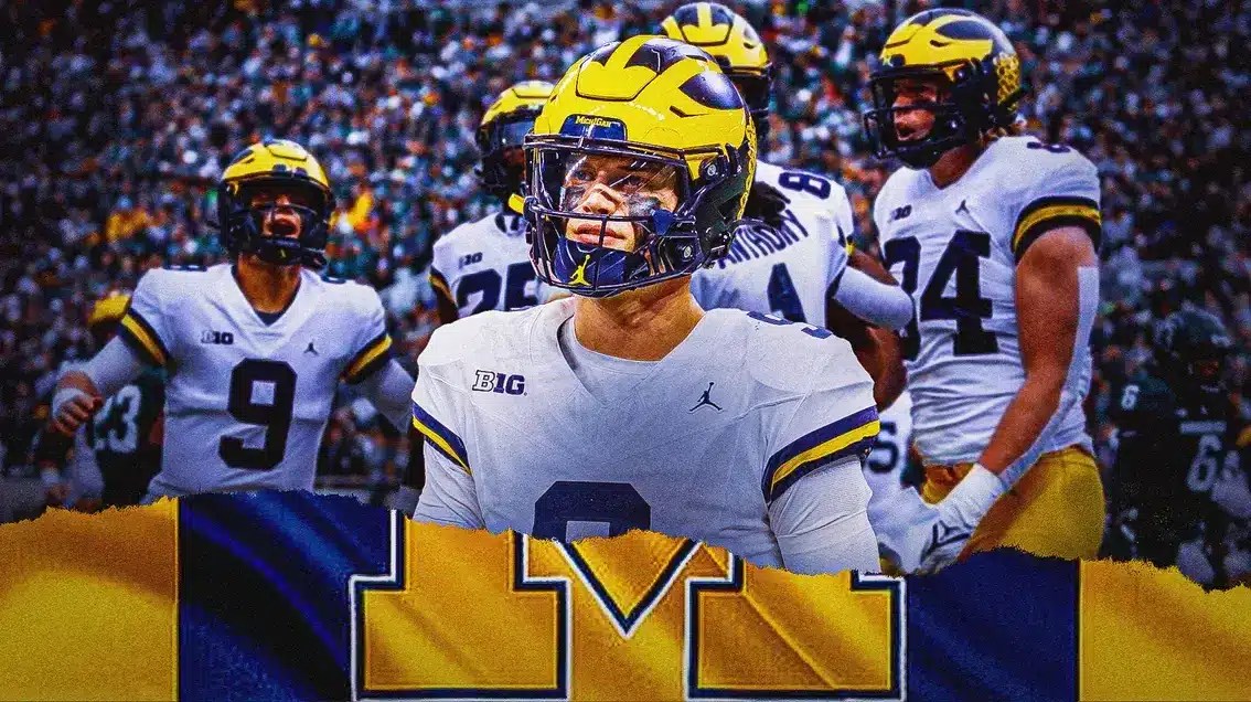 Michigan quarterback J.J. McCarthy with Wolverines players around him.