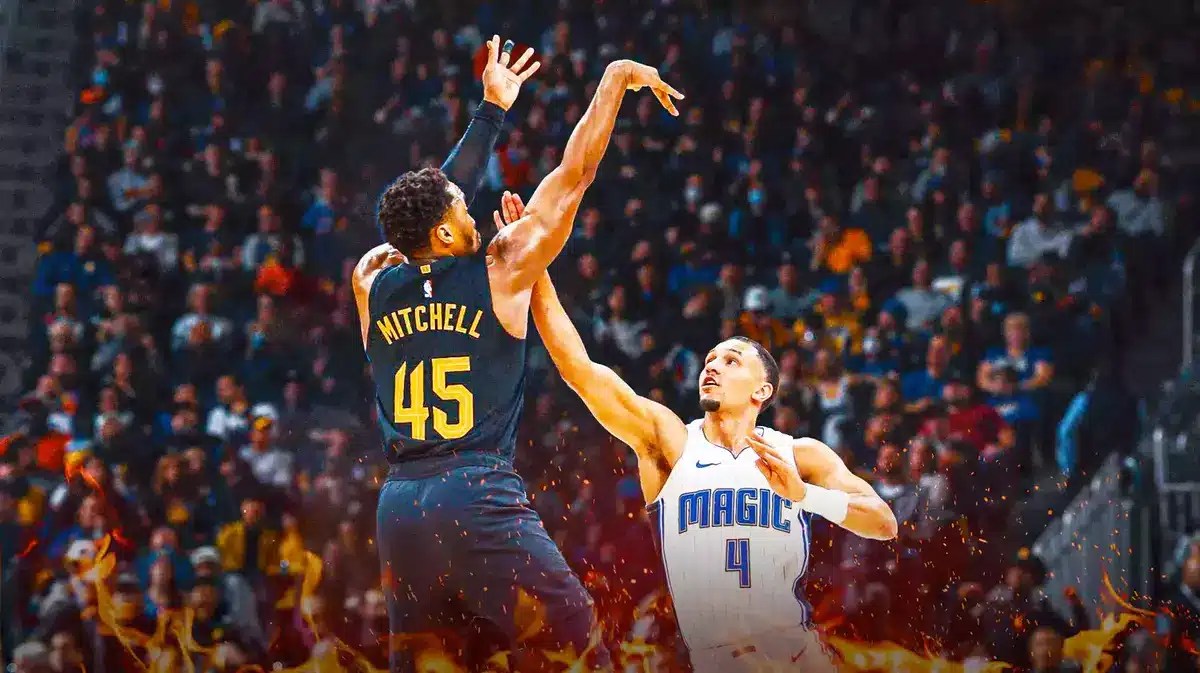 Magic guard Jalen Suggs defending Donovan Mitchell