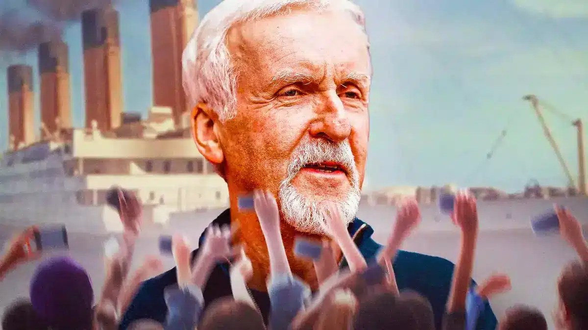 James Cameron with Titanic behind him and fans in front.