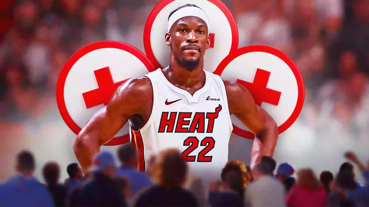 Miami Heat's Jimmy Butler around injury logos in front of the Kaseya Center.
