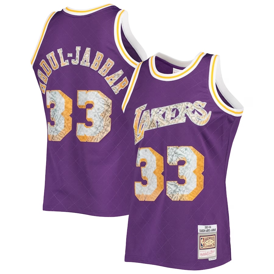 Kareem Abdul-Jabbar Los Angeles Lakers Mitchell & Ness 1996-97 Hardwood Classics NBA 75th Anniversary Diamond Swingman Jersey - Purple color on a white background.