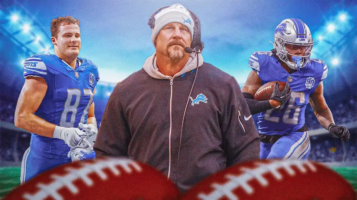 Photo: Dan Campbell in Lions gear with Sam LaPorta and Jahmyr Gibbs in Lions uniforms around him, with fans in the back