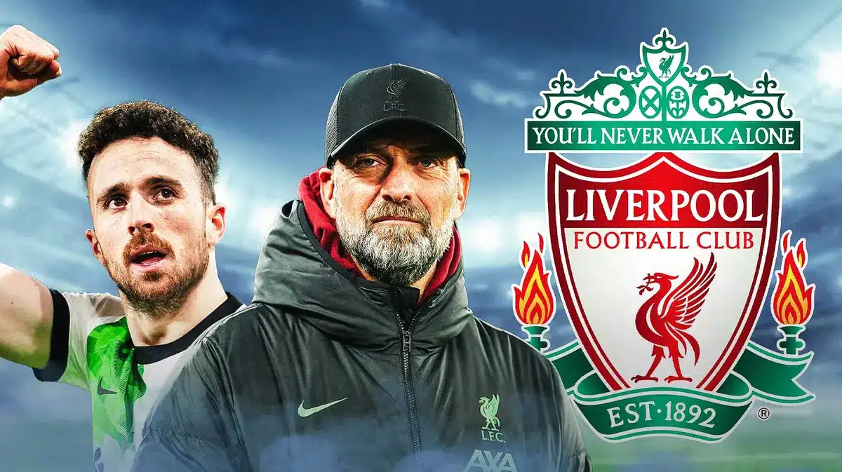 Jurgen Klopp and Diogo Jota in front of the Liverpool logo