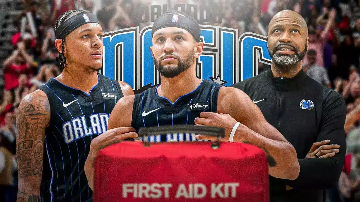 Jalen Suggs in middle looking stern with first aid kit, Paolo Banchero and Jamahl Mosley on either side, ORL Magic logo, basketball court in background