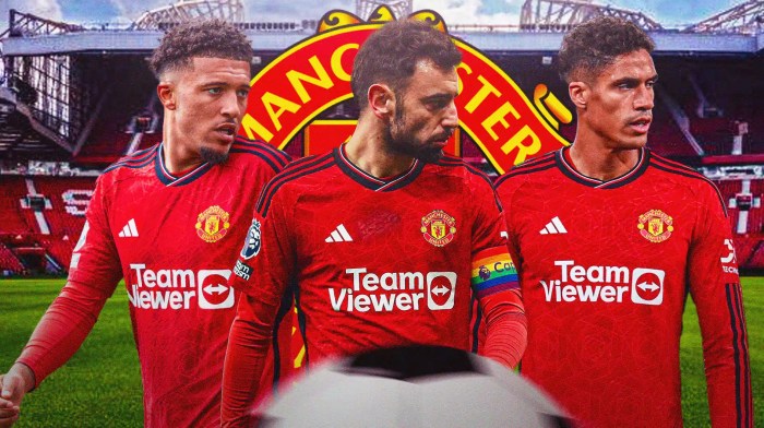Jadon Sancho and Raphael Varane, Bruno Fernandes in front of the Manchester United logo