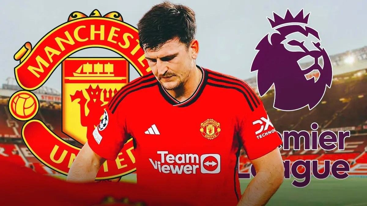 Harry Maguire looking down in front of the Manchester United and Champions League logos