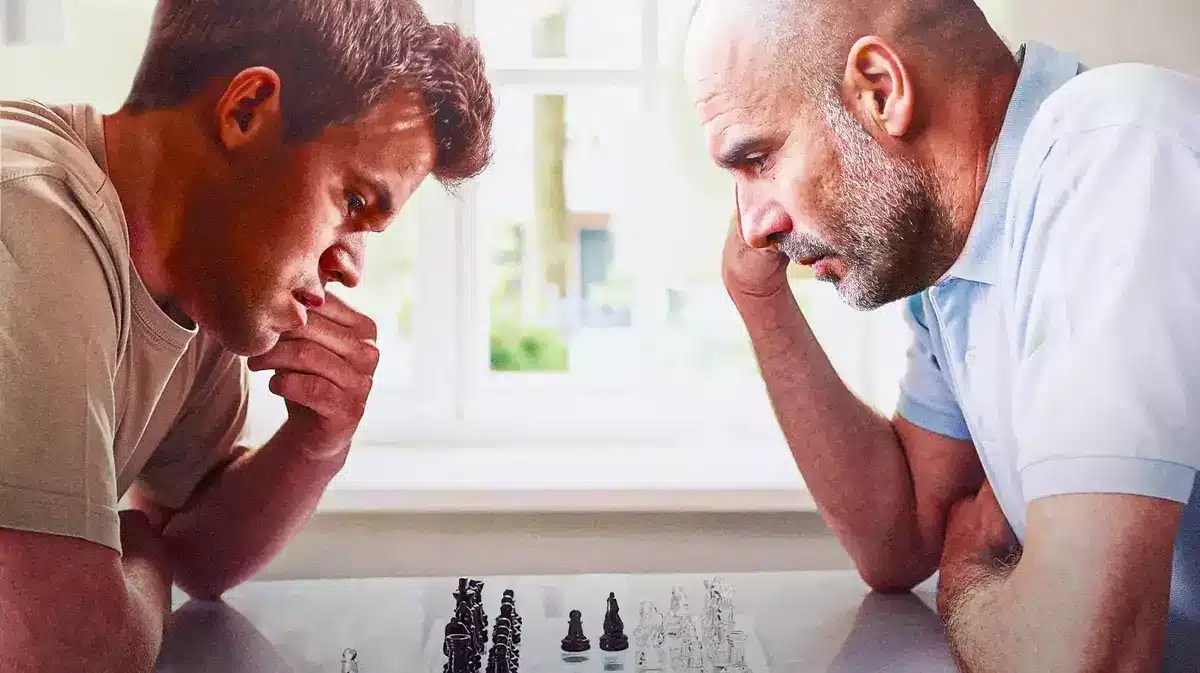 Pep Guardiola and Magnus Carlsen playing chess against each other manchester city