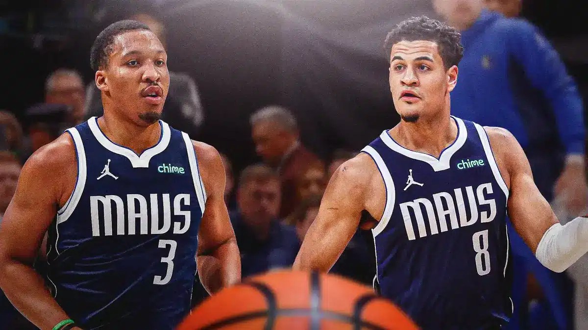 Mavs' Grant Williams, Mavs' Josh Green both looking serious.