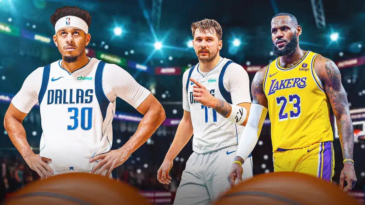 Mavs' Seth Curry walking away from Mavs' Luka Doncic, Lakers' LeBron James.
