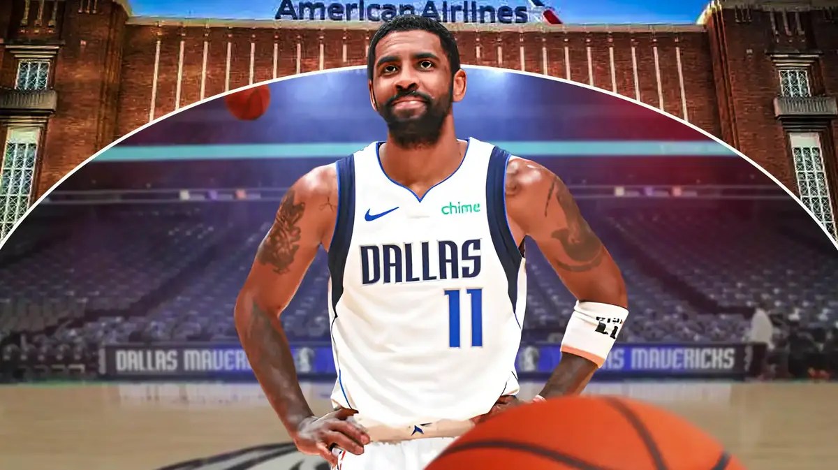 Kyrie Irving smiling with Mavs jersey