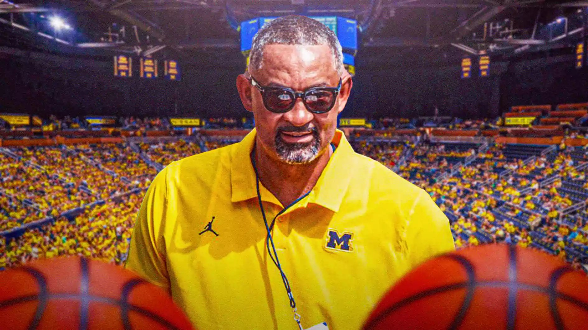 Michigan basketball, Wolverines, Juwan Howard, Jon Sanderson, Juwan Howard fight, Juwan Howard with Michigan basketball arena in the background