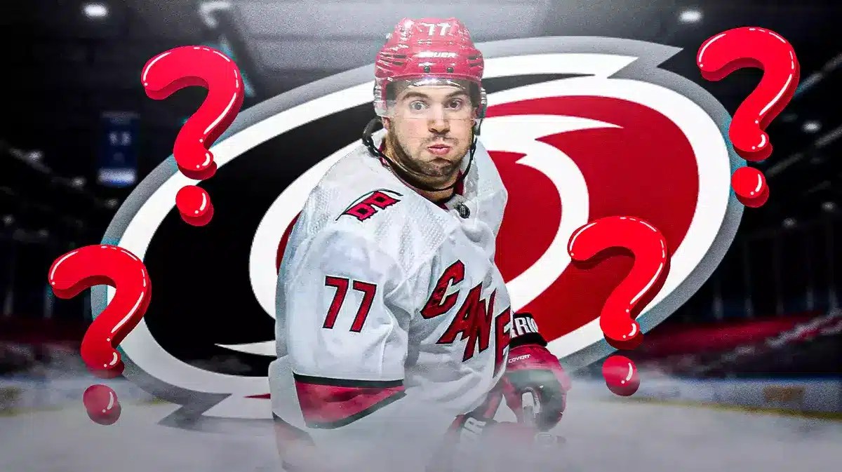 Tony DeAngelo looking stern, a few question marks in image, CAR Hurricanes logo, hockey rink in background