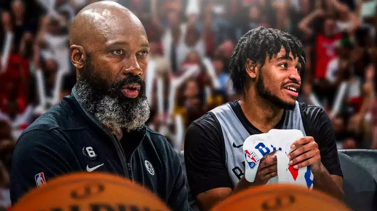 Nets coach Jacque Vaughn and Cam Thomas on the bench.