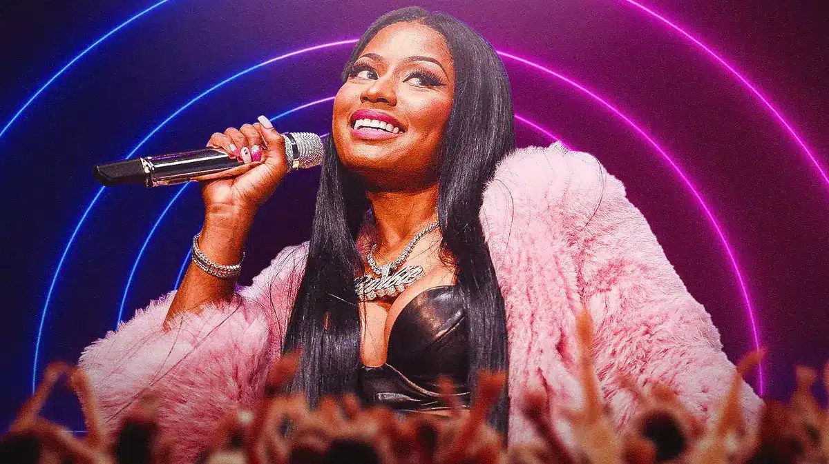 Nicki Minaj on stage with fans in front.