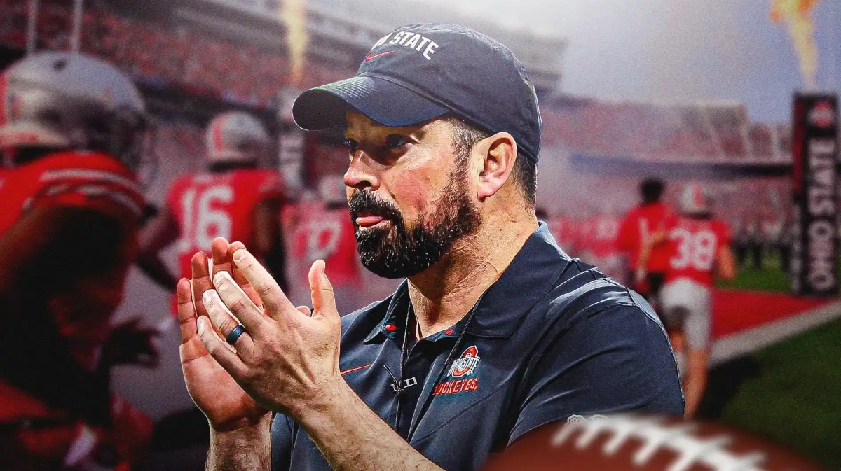 Ohio State football coach Ryan Day clapping.