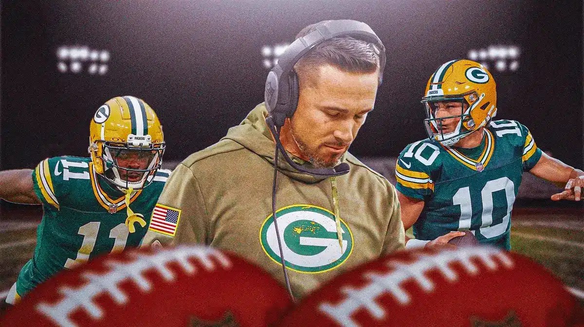 Packers' Matt LaFleur looking down. In background, need Packers' Jordan Love and Packers' Jayden Reed playing football