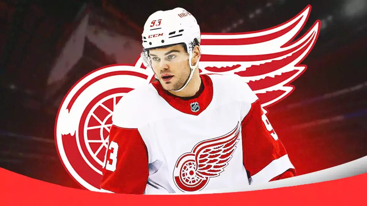 Red Wings star Alex DeBrincat after scoring with Patrick Kane.