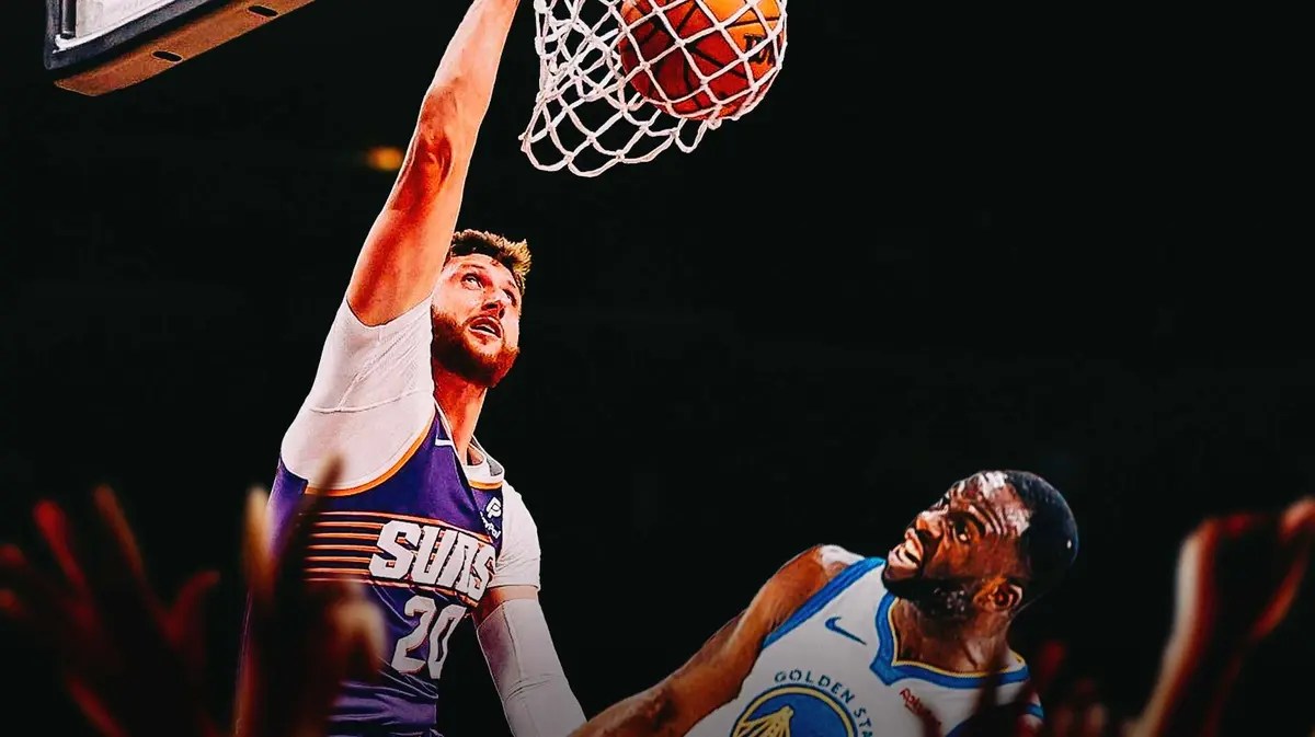 Suns center Jusuf Nurkic dunks on Draymond Green