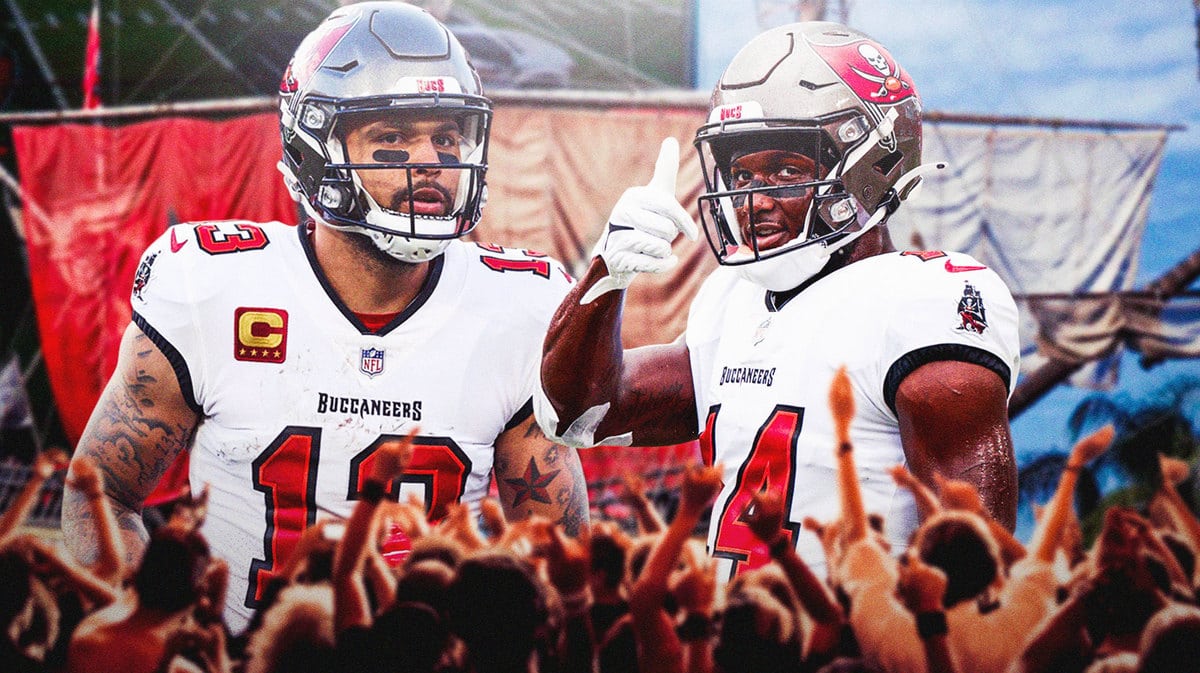 Tampa Bay Buccaneers receivers Mike Evans and Chris Godwin in front of Raymond James Stadium.