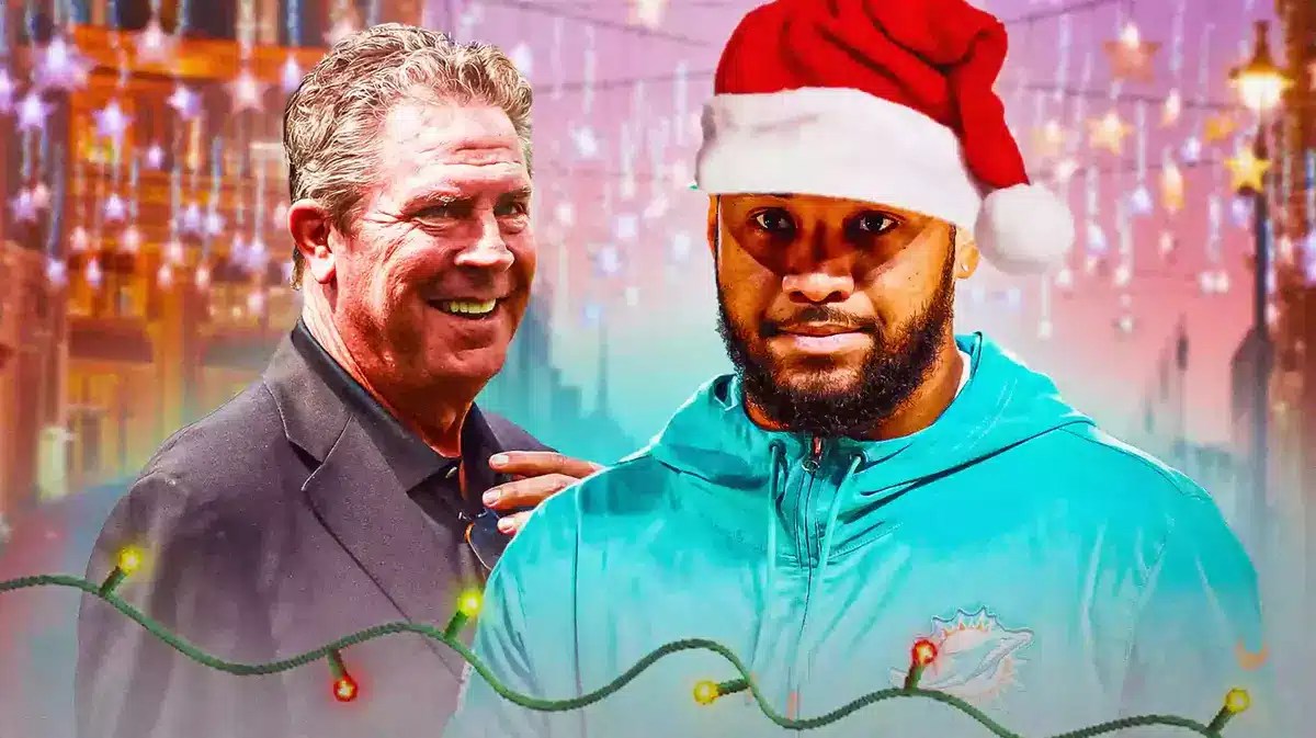 Tua Tagovailoa with a Santa hat on next to Dan Marino