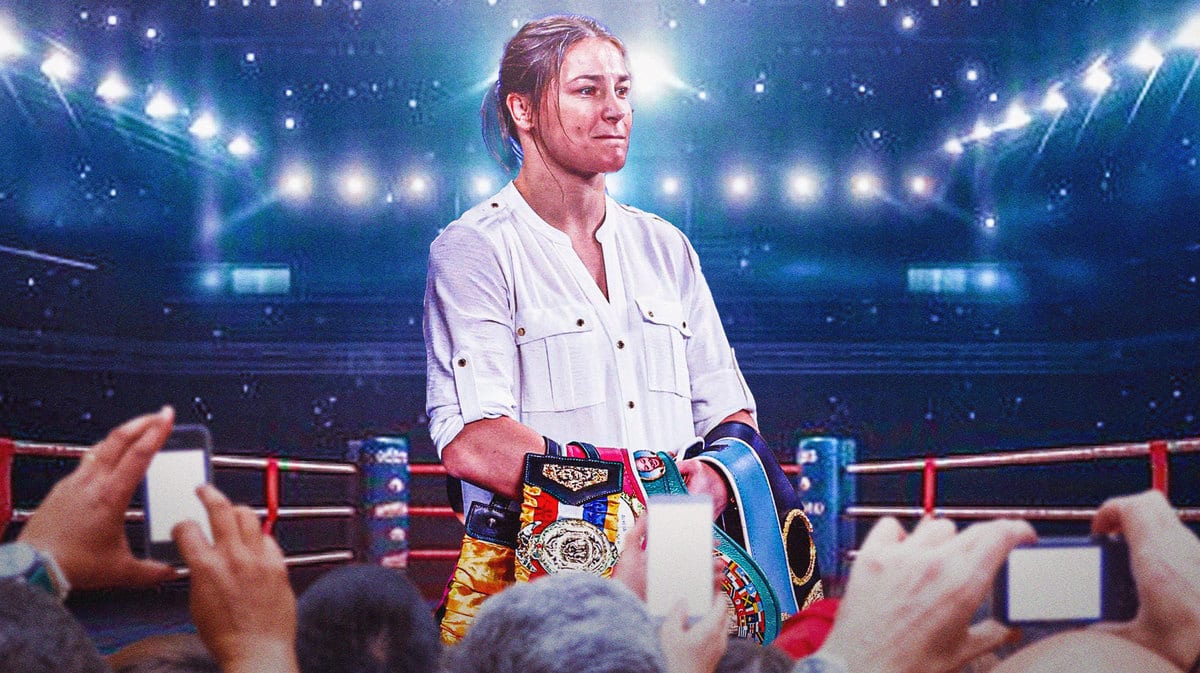 Amanda serrano holding her belts