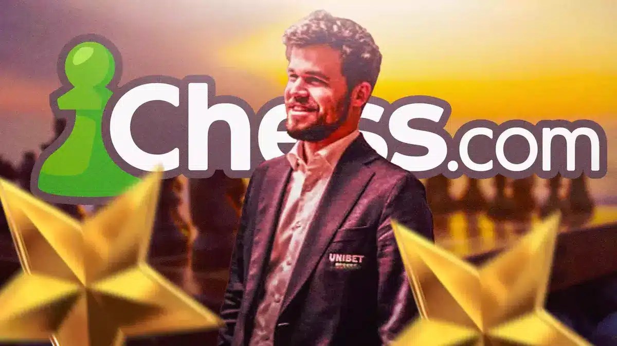 Magnus Carlsen celebrating in front of the Chess.com logo