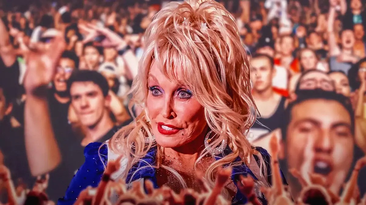 Dolly Parton with fans in the background.