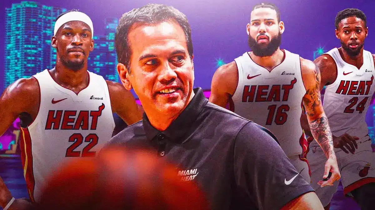 Miami Heat's Erik Spoelstra, Jimmy Butler, Caleb Martin, and Haywood Highsmith in front of the city skyline.