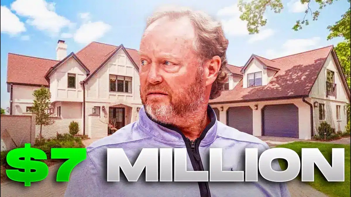 Former Milwaukee Bucks coach in front of the lake house he recently sold.