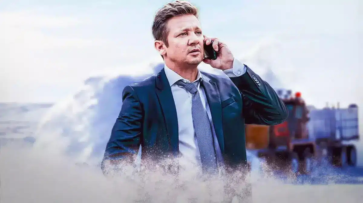 Jeremy Renner with snow plow background.