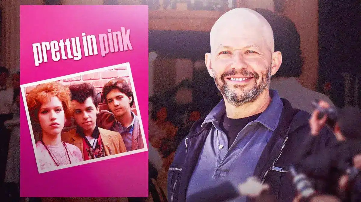 Jon Cryer in front of a Pretty in Pink poster.