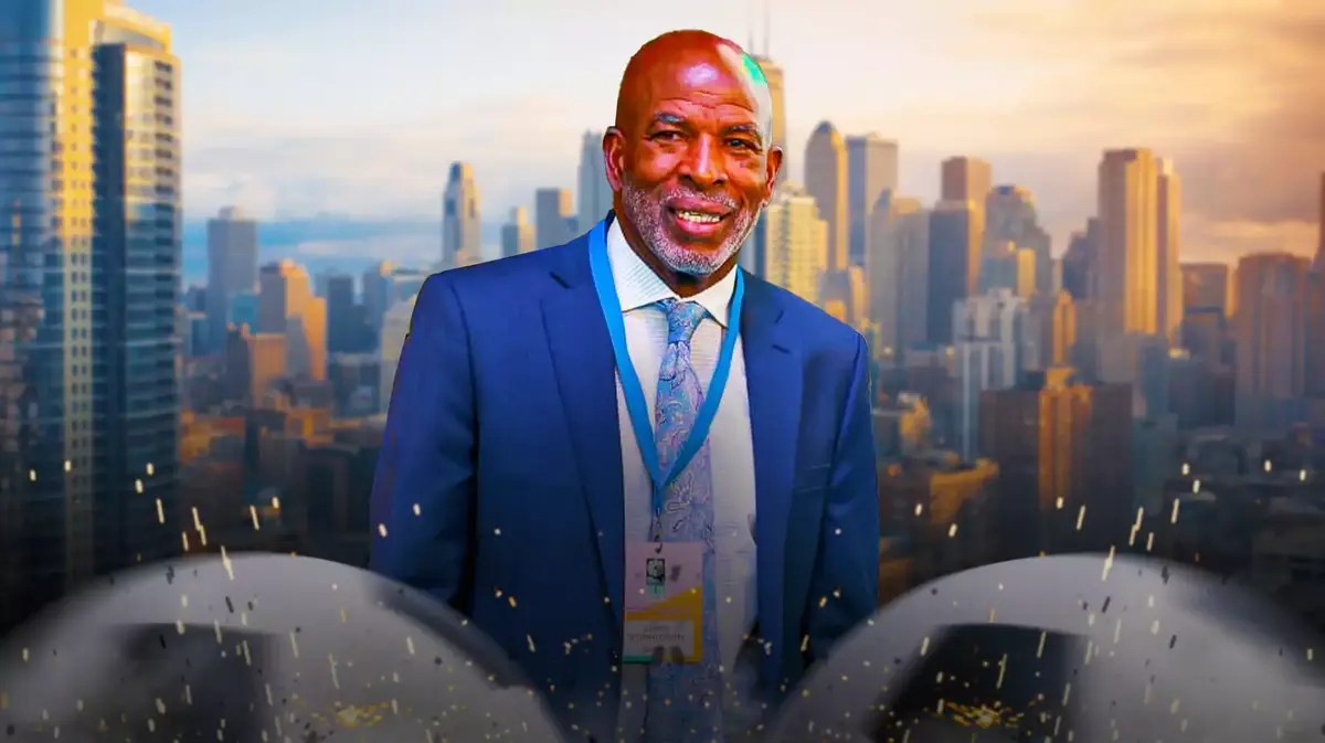 new Red Star head coach Lorne Donaldson with soccer balls, with the city of Chicago, Illinois, skyline in the background behind Donaldson