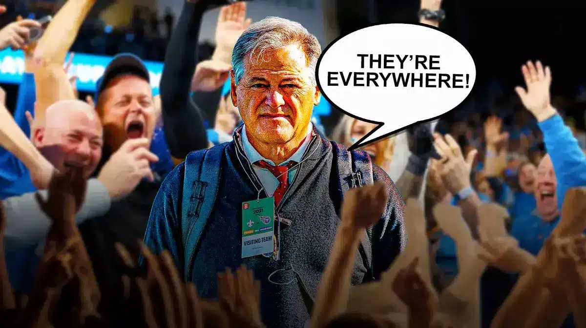 Saints GM Mickey Loomis surrounded by Lions fans