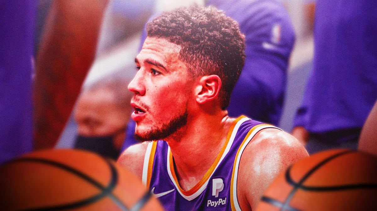 Suns'Devin Booker who is out with an injury vs the Nuggets.