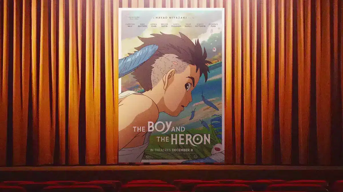 The Boy and the Heron poster with movie theater background.