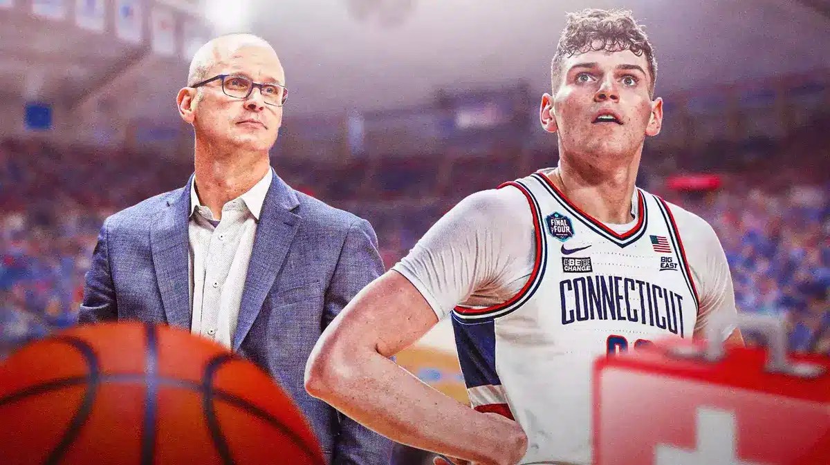 Dan Hurley, Donovan Clingan with a medical cross near him