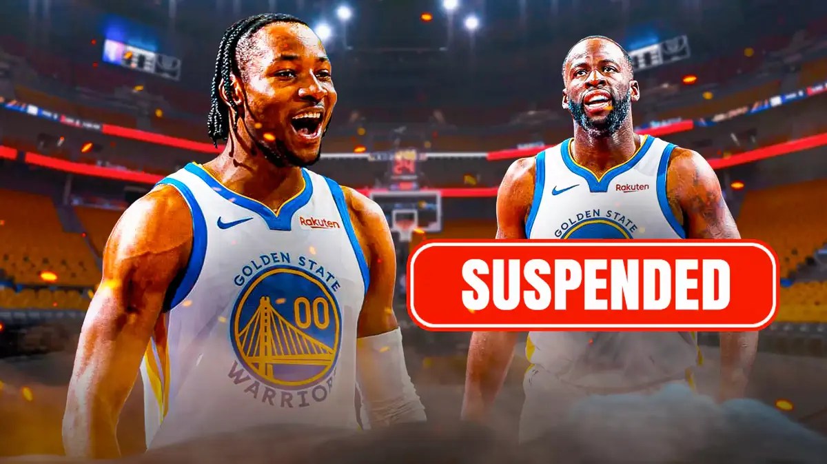 Jonathan Kuminga shouting/hyped up with Draymond Green at the back with a sign that says “Suspended”
