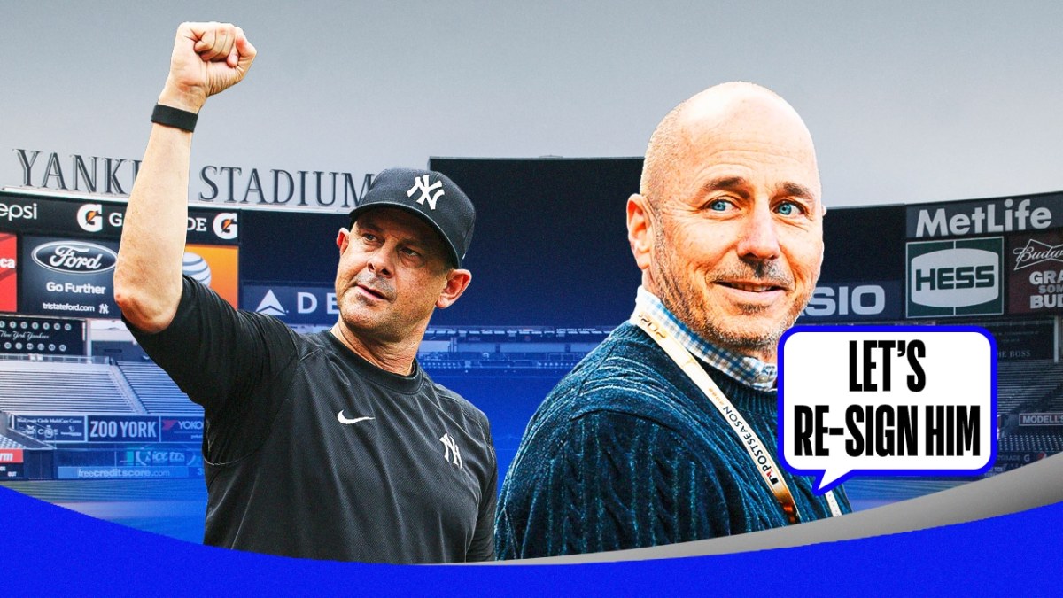 Yankees' Brian Cashman saying: Let’s re-sign him! Have him saying it to Yankees' Aaron Boone. Yankee Stadium background.