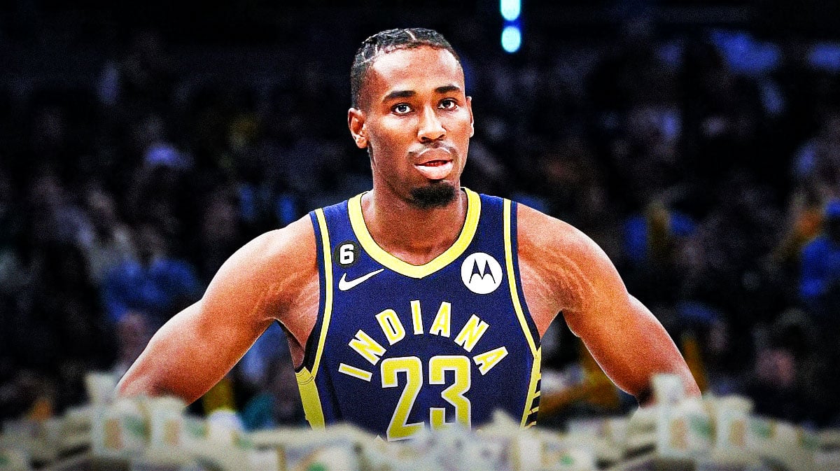 Aaron Nesmith surrounded by piles of cash.