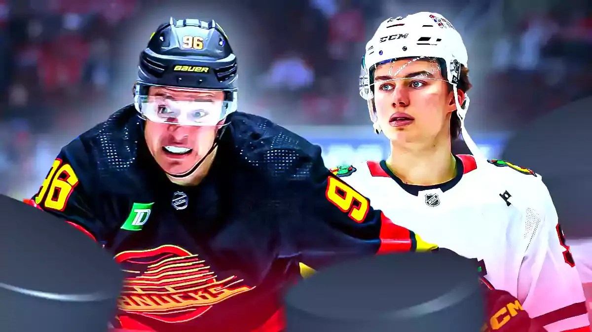 Andrei Kuzmenko (Canucks) with Connor Bedard (Blackhawks)