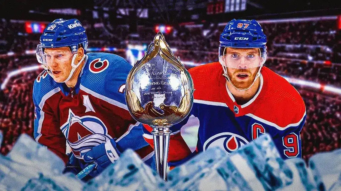 Nathtan MacKinnon and Conor McDavid with Hart Memorial Trophy